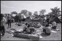 Men unwind near a Gay Liberation banner at the May Day protesters' West Potomac Park campsite, 01-03 May 1971