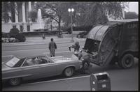 May Day protesters pull cardboard boxes from a garbage truck on Pennsylvania Ave near the National Gallery to create road hazards, 01-03 May 1971
