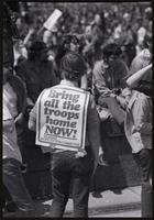 A man wears a sign: "Bring all the troops home now! Student Mobilization Committee" during the Vietnam War Out Now demonstration, 24 April 1971