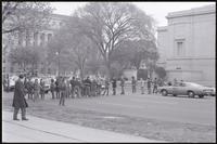 A group of protesters link arms to block traffic on 9th St NW during the May Day protests, 03 May 1971