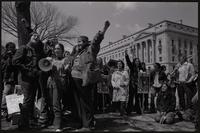 Alternate view of women chanting slogans on Constitution Ave near the Department of Justice, with images of Nguyễn Thị Bình and Ericka Huggins during anti-war demonstrations, possibly Vietnam War Out Now, 17-24 April 1971