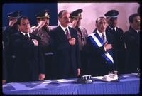 Vice President José Francisco Merino López, President Alfredo Cristiani, and former President José Napoleón Duarte stand for the national anthem at the inauguration ceremony, San Salvador, El Salvador