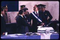Former President José Napoleón Duarte passes off the Presidential sash to Alfredo Cristiani during his inauguration, San Salvador, El Salvador