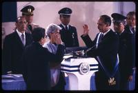 Former President José Napoleón Duarte watches as Alfredo Cristiani is sworn in as President, San Salvador, El Salvador