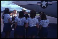 Women greeting pilots upon arrival