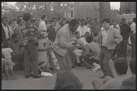 A drum circle plays and people dance at Dupont Circle in Washington, D.C., undated