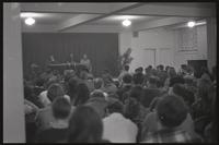 The crowd listens while Paul Jacobs and Charles Cassell speak to them at an event at Concordia Church, Washington, D.C., 14 February 1968 or 1969