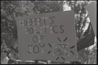A sign is held referencing Hubert Humphrey and the police brutality at the Democratic National Convention in Chicago, Lafayette Park, 31 August 1968