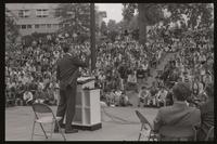 Former U.S. Representative Adam Clayton Powell stands and addresses a crowd at American University, 13 October 1968
