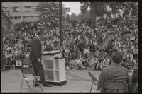 Audience members sit in the amphitheater and listen to former U.S. Representative Adam Clayton Powell give an address at American University, 13 October 1968