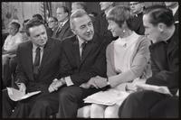 Senator Eugene McCarthy clasps hands and converses with those sitting next to him at the Unity Day Rally hosted in the Mayflower Hotel, Washington, D.C., 10 November 1968