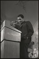 A priest speaks from the podium at the Unity Day Rally hosted in the Mayflower Hotel, Washington, D.C., 10 November 1968