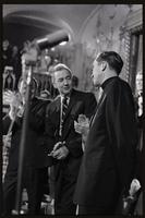 A priest receives applause while standing on stage near Senator Eugene McCarthy at the Unity Day Rally hosted in the Mayflower Hotel, Washington, D.C., 10 November 1968