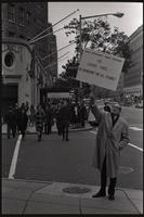 A man raises a sign that says "Less criticism, more support for Cardinal O'Boyle - an Archbishop for all seasons!" outside the Unity Day Rally hosted in the Mayflower Hotel, Washington, D.C., 10 November 1968