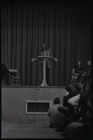 Addressing a crowd, Dick Gregory speaks to students at American University, Washington, D.C., 16 February 1969
