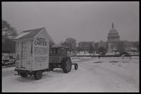 An outhouse, dubbed "Hotel Carter," sits atop a trailer attached to a tractor parked on the National Mall in participation with the American Agriculture Movement's second Tractorcade demonstration in Washington, D.C., 28 February 1979