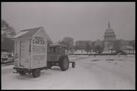 An outhouse, dubbed "Hotel Carter," sits on a trailer attached to a tractor parked on the National Mall in participation with the American Agriculture Movement's second Tractorcade demonstration in Washington, D.C., 28 February 1979