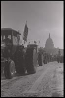 Tractors drive down Pennsylvania Avenue from the U.S. Capitol Building during the American Agriculture Movement's second Tractorcade demonstration in Washington, D.C., 28 February 1979