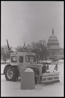 A tractor displays protest signs in support of the American farmer while sitting parked on the National Mall near the U.S. Capitol Building during the American Agriculture Movement's second Tractorcade demonstration in Washington, D.C., 28 February 1979