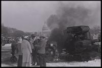 Demonstrators converse in front of burning farm vehicles on the National Mall near the U.S. Capitol Building during the American Agriculture Movement's second Tractorcade demonstration in Washington, D.C., 28 February 1979