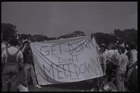 Demonstrators, from the University of Delaware, at an anti-nuclear power protest hold a sign that says "Get down don't melt down. High mom send $$" on the National Mall in Washington, D.C., 06 May 1979