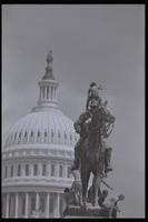 A male demonstrator sits on top of the Ulysses S. Grant Memorial on the U.S. Capitol Grounds while others sit around the base during an anti-nuclear power demonstration in Washington, D.C., 06 May 1979