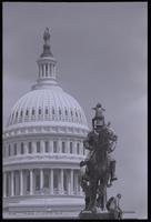 A male protester sits atop the Ulysses S. Grant Memorial on the U.S. Capitol Grounds while others sit around the base during an anti-nuclear power demonstration in Washington, D.C., 06 May 1979