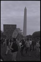 Two protesters holding signs that read "Nuclear waste is unhealthy for children and other living things" and "No nukes, a bright idea" near the Washington Monument during an anti-nuclear power demonstration in Washington, D.C., 06 May 1979