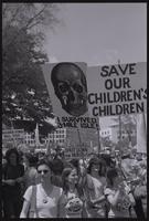 Anti-nuclear protesters march along Pennsylvania Avenue holding demonstration signs that read "I survived 3-Mile Island!," "Save our children's children," "Shut down the nukes! CEPA," and "Consumer power will stop nuclear power" in Washington, D.C., 06 Ma