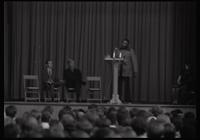 Dick Gregory gives a speech to a large crowd of American University students in the Leonard Center, Washington, D.C., 16 February 196