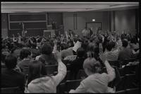 Hands are raised at the New AU meeting about student parity on faculty committees at American University, Washington, D.C., 24 April 1969