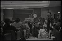 People stand and watch speakers from the New AU organization talk about student parity on faculty committees at American University, Washington, D.C., 24 April 1969