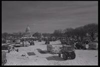View of the tractor and farmer encampment on the National Mall near the U.S. Capitol Building during the American Agriculture Movement's second Tractorcade demonstration in Washington, D.C., 28 February 1979