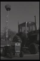 Two tractors parked along the National Mall, one with a sign that reads "1000 bushels for this" during the first Tractorcade demonstration, Washington, D.C., 18 January 1978