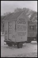 A white outhouse, called "Hotel Carter," on display on the National Mall during the second Tractorcade demonstration, 28 February 1979