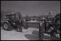 Tractors, displaying Confederate flags, American flags, and American Agriculture Movement flags, are parked on the National Mall near the U.S. Capitol Building as part of the second Tractorcade encampment in Washington, D.C., 28 February 1979