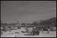 View of the tractor encampment on the National Mall near the U.S. Capitol Building during the American Agriculture Movement's second Tractorcade demonstration in Washington, D.C., 28 February 1979