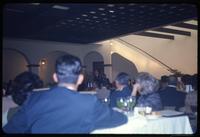 Luncheon attendees listening to Jack Child translate General Weyand's remarks