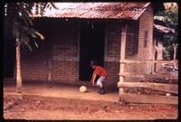Local boy playing with ball near Yalí