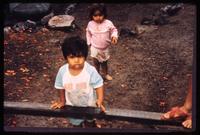 Children walking in gravel in Estelí