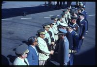 Military personnel shaking hands during departure 