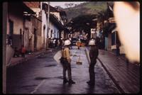 Military personnel standing in street during Sandinista National Liberation Front town hall take down 