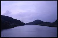 Body of water near Panama Canal surrounded by hills