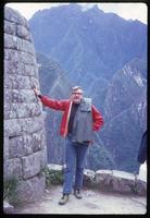 Close view of Jack Child leaning on Machu Picchu stones
