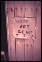 "What Ain't We Got" sign at Trinity hut