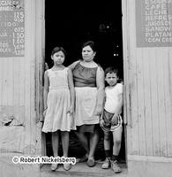 A Cook And Her Children In Downtown San Salvador