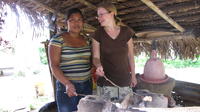 Rachel Teter and a woman roast marshmallows for s'mores in El Plátano, Panama