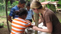 Rachel Teter grabs a cookie from a bowl to make s'mores, El Plátano, Panama