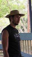 Close-up of a man wearing a straw hat at an agribusiness seminar in Bocas del Toro, Panama