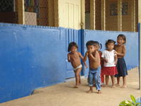 Ngöbe children play together outside of building, la Comarca de Ngöbe-Buglé, Panama 